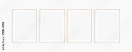 Frame mockup 5x7, 50x70, A4, A3, A2, A1. Set of four thin light wood frames. Gallery wall mockup, set of 4 frames. Clean, modern, minimalist, bright. Portrait. Vertical. Mat opening 2:3.