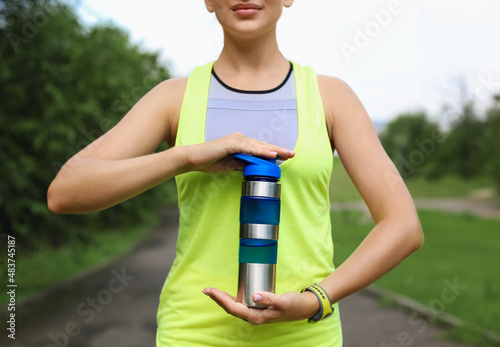 Woman in sportswear holding...