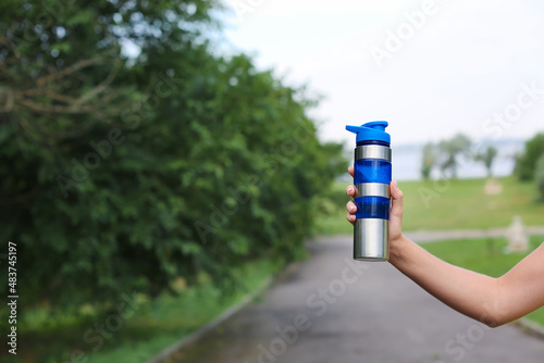 Female hand with bottle of ...