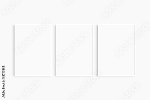 Frame mockup 5x7, 50x70, A4, A3, A2, A1. Set of three thin white frames. Gallery wall mockup, set of 3 frames. Clean, modern, minimalist, bright. Portrait. Vertical.