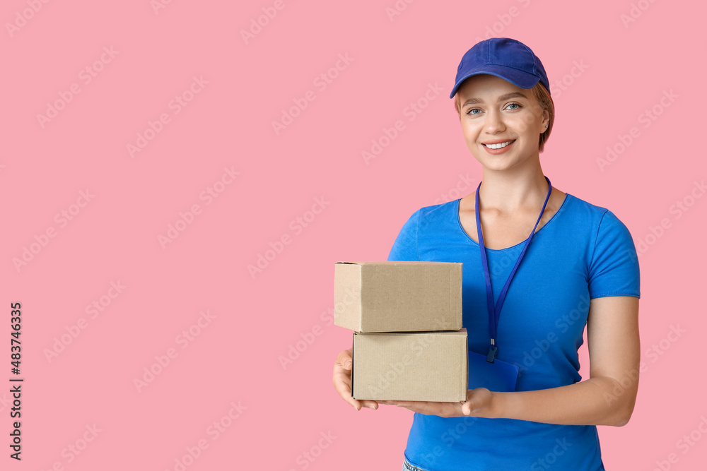 Female courier with parcels on color background Female courier with parcels on color background