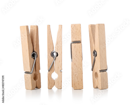 Wooden clothespins on white background