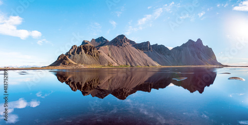 beautiful landscape with most breathtaking mountains Vestrahorn on the Stokksnes peninsula in the mirror of the lake. Exotic countries. Amazing places. (Meditation, antistress - concept). © anko_ter
