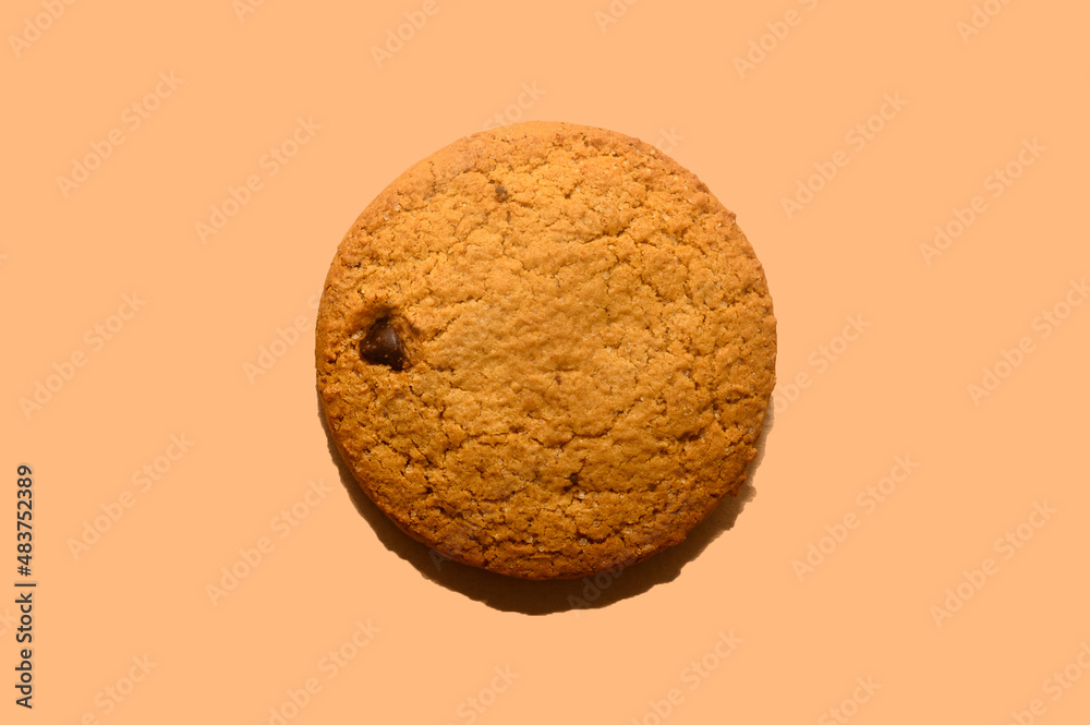 Oatmeal cookies on a beige background. Diet food. Close-up. Oatmeal cookies on a beige background. Diet food. Close-up.