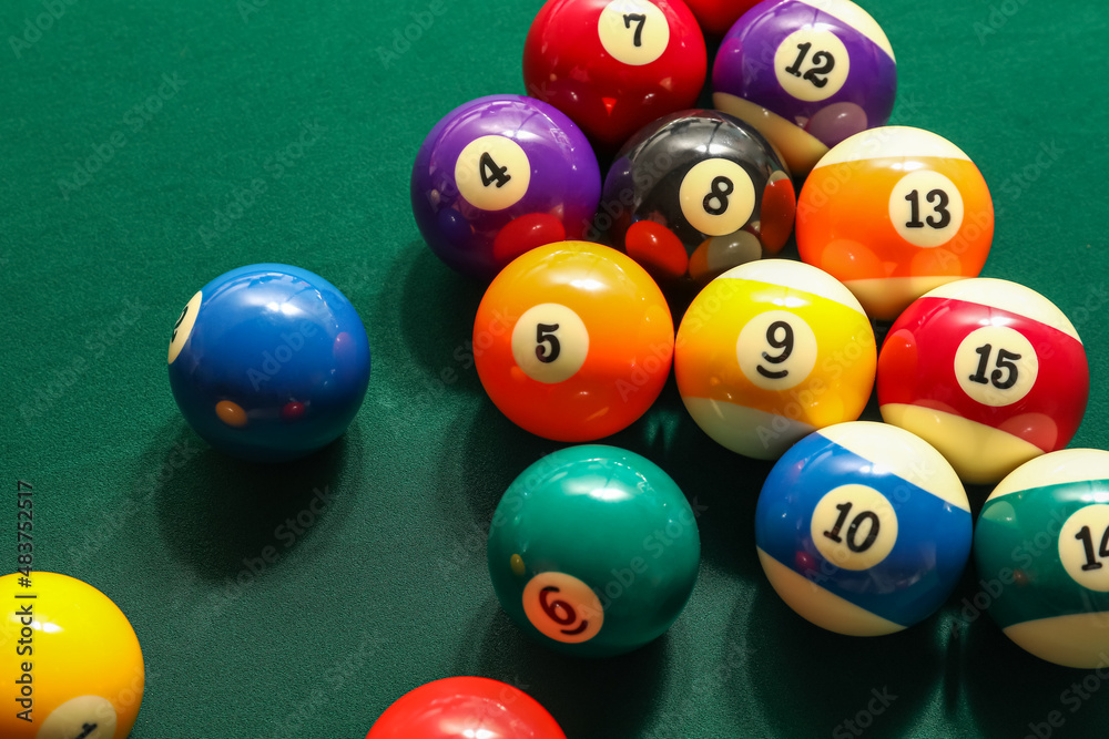 Different billiard balls on green table Different billiard balls on green table