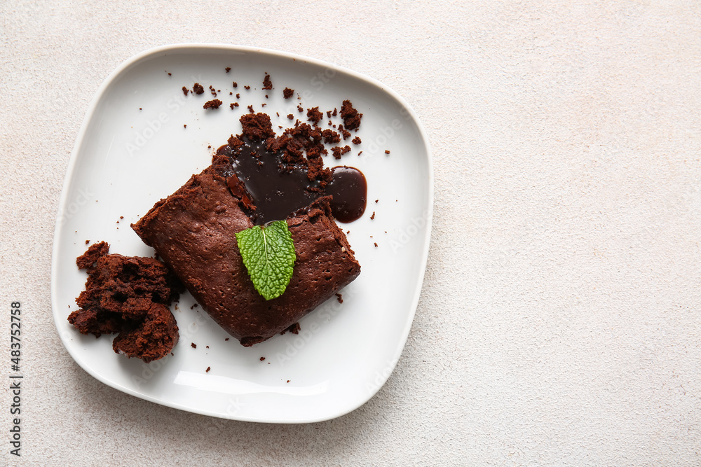 Plate with pieces of tasty chocolate brownie on white background Plate with pieces of tasty chocolate brownie on white background