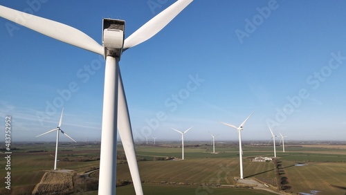 Close-up drone view of working Wind Turbines in a field in Withernsea, UK