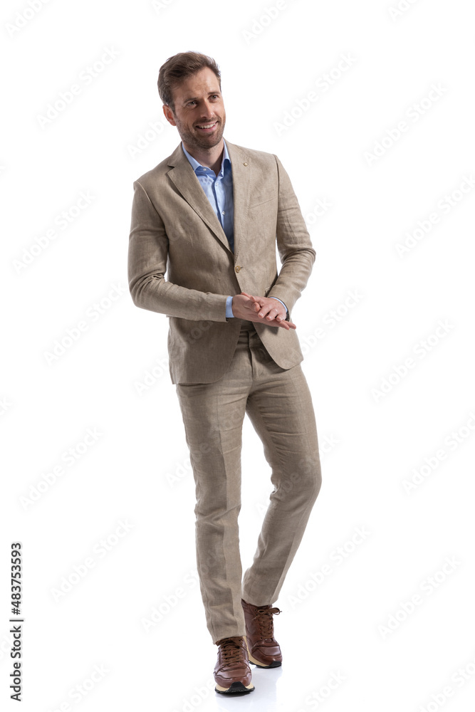 businessman rubbing his palms, smiling wide and walking businessman rubbing his palms, smiling wide and walking