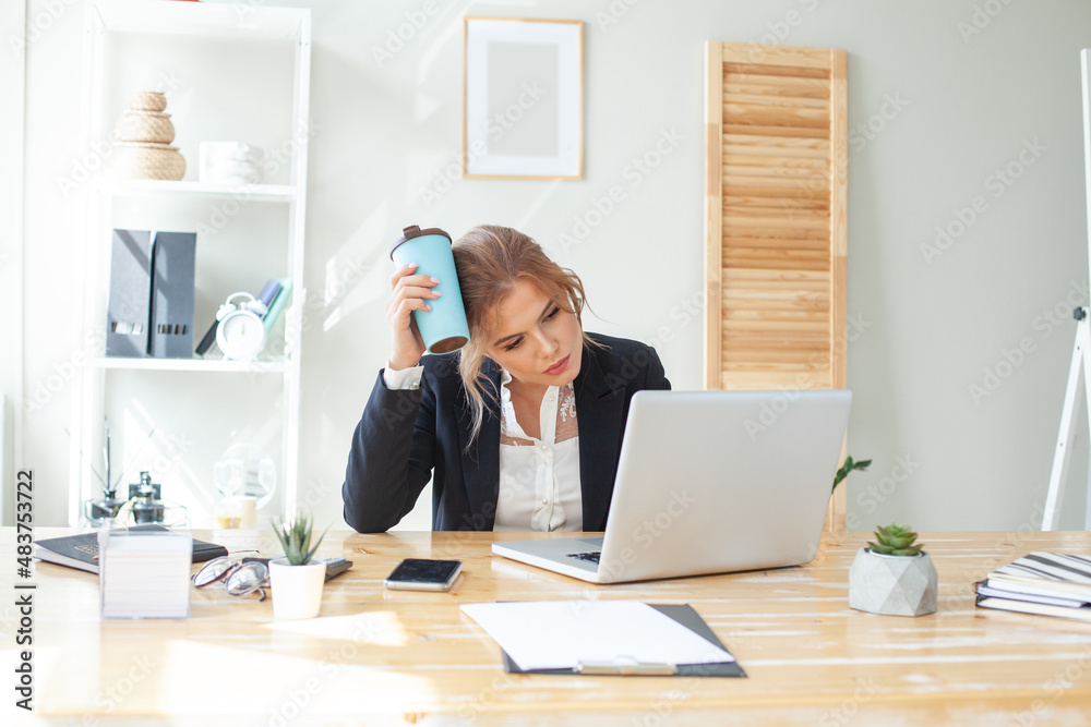 Businesswoman working hard and drinking coffee in office Businesswoman working hard and drinking coffee in office