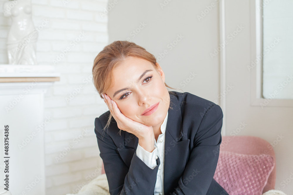 Serene young woman relaxing on armchair in living room at home, stress free concept. Serene young woman relaxing on armchair in living room at home, stress free concept.
