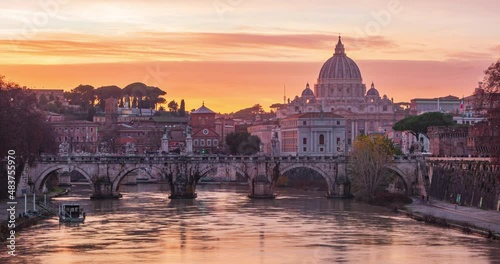 4K timelapse footage of Basilica of Saint Peter seen from the bridge at the sunset, Vatican, Italy, Rome photo
