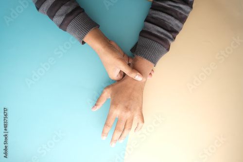 man suffering pain in hand top view 