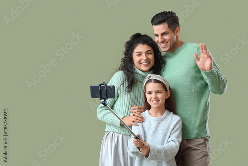 Happy parents with little d...