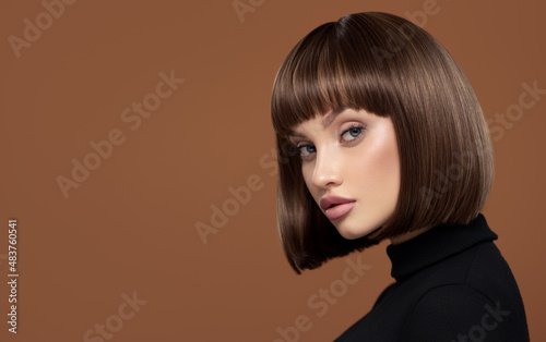 Portrait of a beautiful girl with short brown hair.