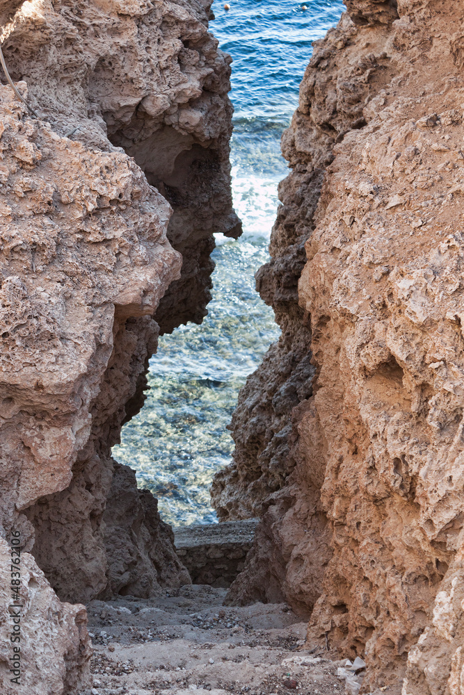 A narrow dangerous passage between the rocks to the sea