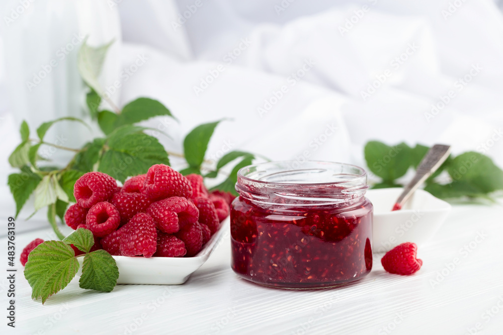 Jar of raspberry jam and fresh berries. Jar of raspberry jam and fresh berries.