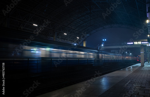 train at the station in the night fog