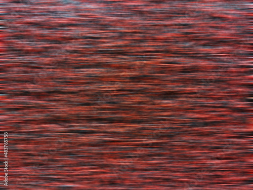 Blurred image of red and black doormat for background.