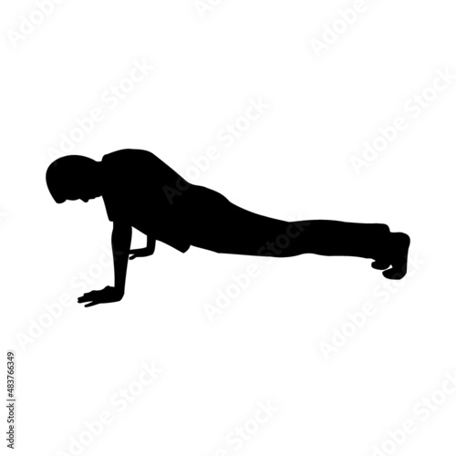 Silhouette of male kid doing push ups