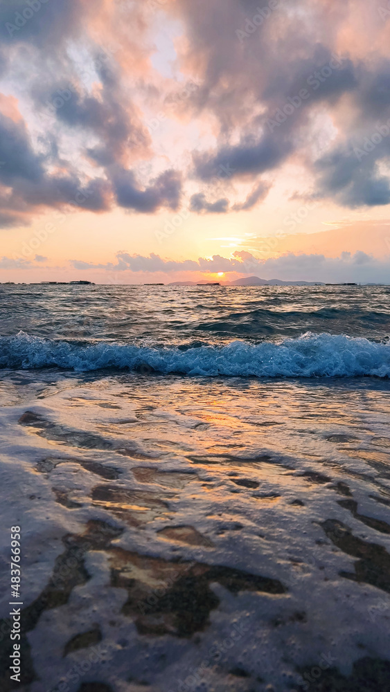 Beautiful sunset over sea. Colorful sky with clouds and waves from the beach. Beautiful sunset over sea. Colorful sky with clouds and waves from the beach.