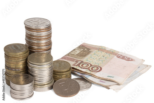 A stack of Russian coins and some bills. Heap of money on white background.