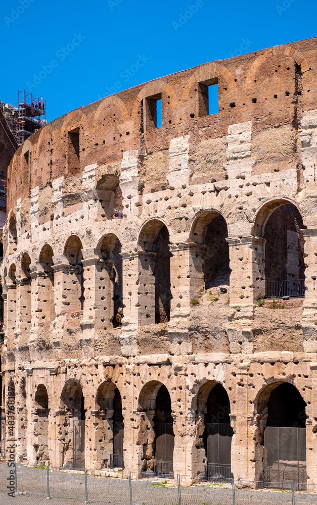 Colosseum ancient theater known as Flavian Amphitheatre aside Palatine Hill and Roman Forum Romanum in historic city center of Rome in Italy