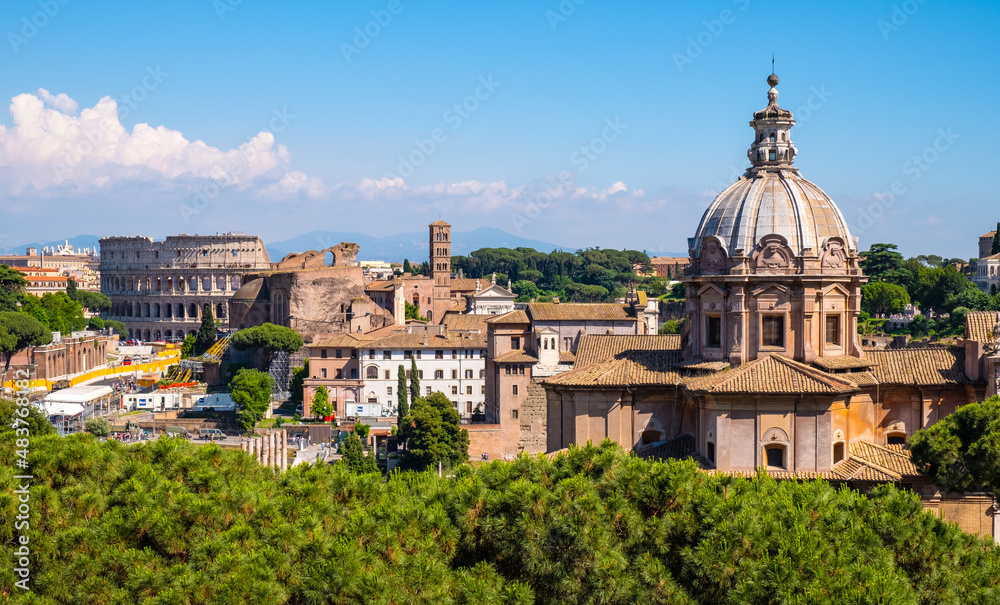 Panorama of Roman Forum Romanum with Santi Luca and Martina martyrs church and Colosseum in historic center of ancient Rome in Italy