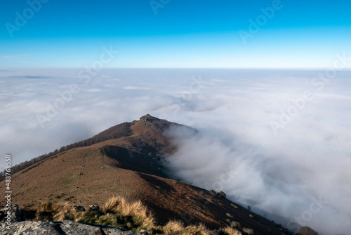 Vista panorâmica desde a montanha de La Rhune no País Basco com montanhas ao fundo com algum nevoeiro nos altos photo