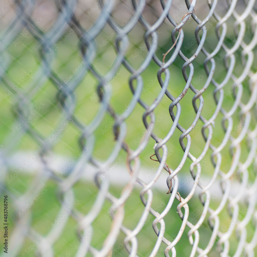 Close-up chain link fence , Sunset background Close-up chain link fence , Sunset background