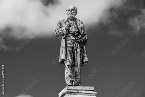Outdoor bronze statue, monument of Luigi Orlando in Livorno, Tuscany, Italy in black and white photo