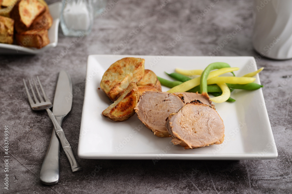 roast pork dinner with knife and fork roast pork dinner with knife and fork