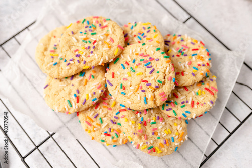 Sugar cookies with sprinkles, colorful coffee treat. freshly baked dessert cookies. 