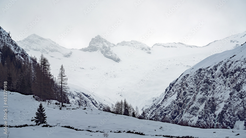 stormy and grey day in the alps at a cold winter day stormy and grey day in the alps at a cold winter day