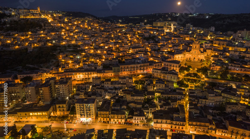 Aerial View of Modica City Centre at Night with the Lunar Eclipse, Ragusa, Sicily, Italy, Europe