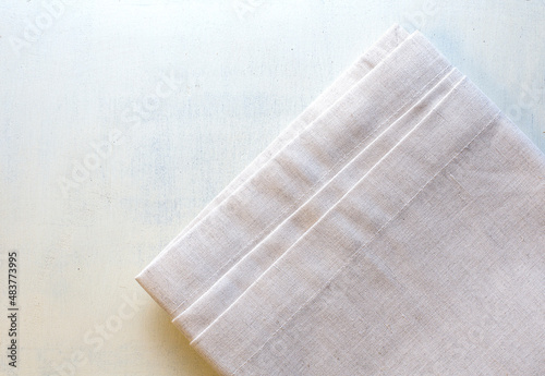 Napkin close-up on a wooden background. Copy space