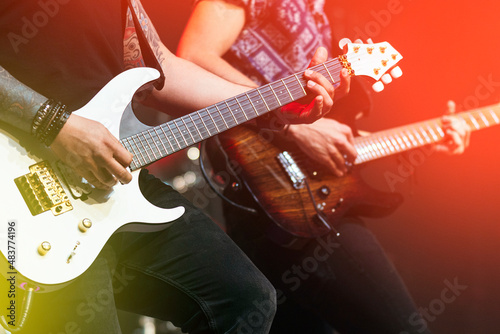 Принти на полотні Two guitarists performing at a live concert.