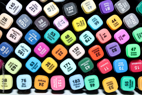 Set of colored markers. Color numbers on caps. Close-up.