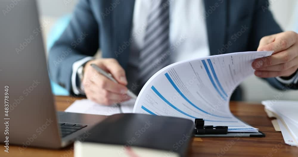 Business man studying and signing documents at table closeup 4k movie slow motion