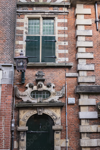 Architectural fragments of Vleeshal building (former meat-hall) - historical building dating from 1603 on Haarlem Grote Markt. Haarlem, North Holland, the Netherlands. photo