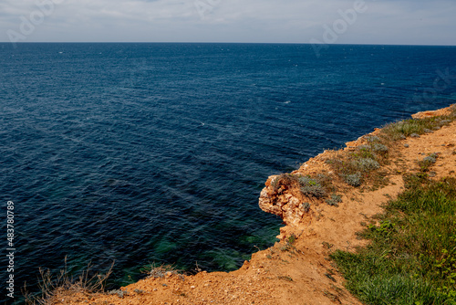 Yellow sea shore with a view of the water
