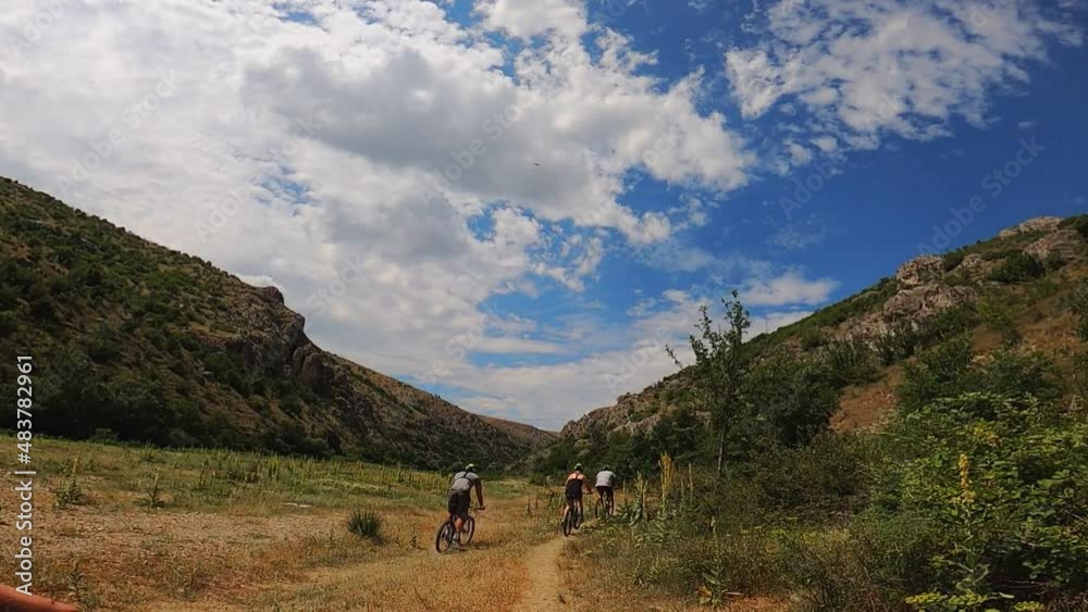 Group of friends having a fun while riding a bike in mountain. Group of friends having a fun while riding a bike in mountain.