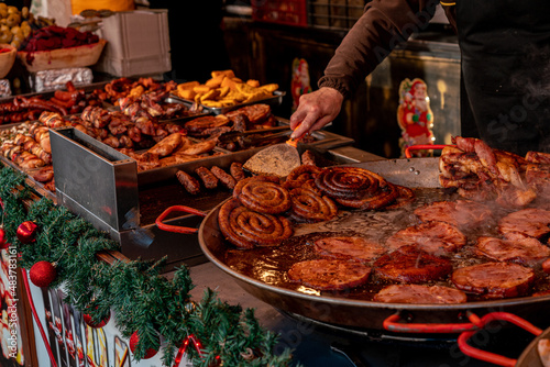 Sizzling meats at Christmas Traditional Food Market Fair in Timisoara, Romania