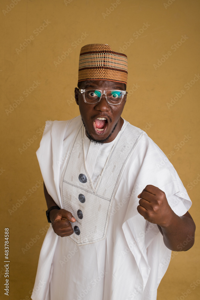 A Traditionally Dressed Northern Business Man in Glasses Happily Scream