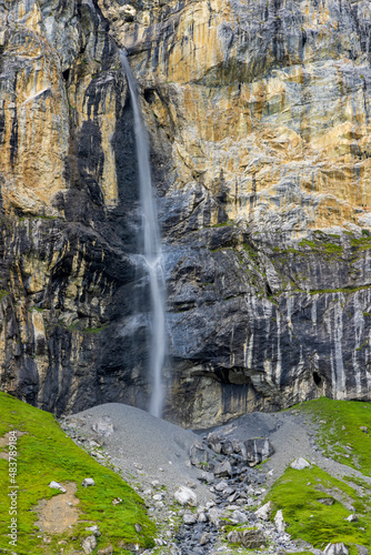 Typical alpine landscape with waterfalls, Swiss Alps near Klausenstrasse, Spiringen, Canton of Uri, Switzerland photo