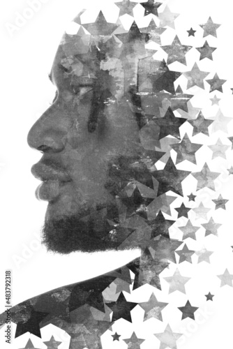A double exposure portrait of an African American man combined with digital art.