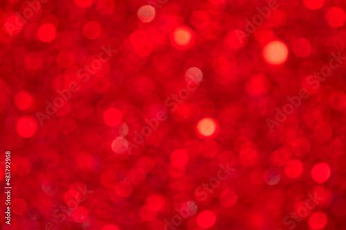 Red bokeh from many round highlights. Background. Texture.