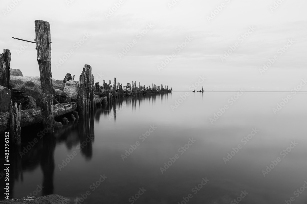 an old pier made of stones and wood