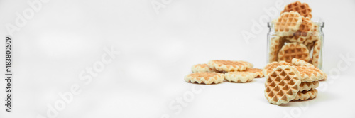 Belgian waffles on a table. holiday cookies on a white background. fresh baking concept. sweet desserts on a light texture