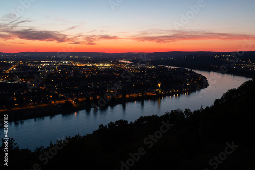 Koblenz am Rhein after sunset. The city lights are on.