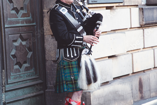 Scotsman playing the bagpipes in Edinburgh photo